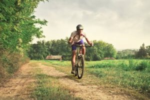 Mountain biker on the country road