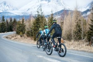 Mountain bikers riding on road